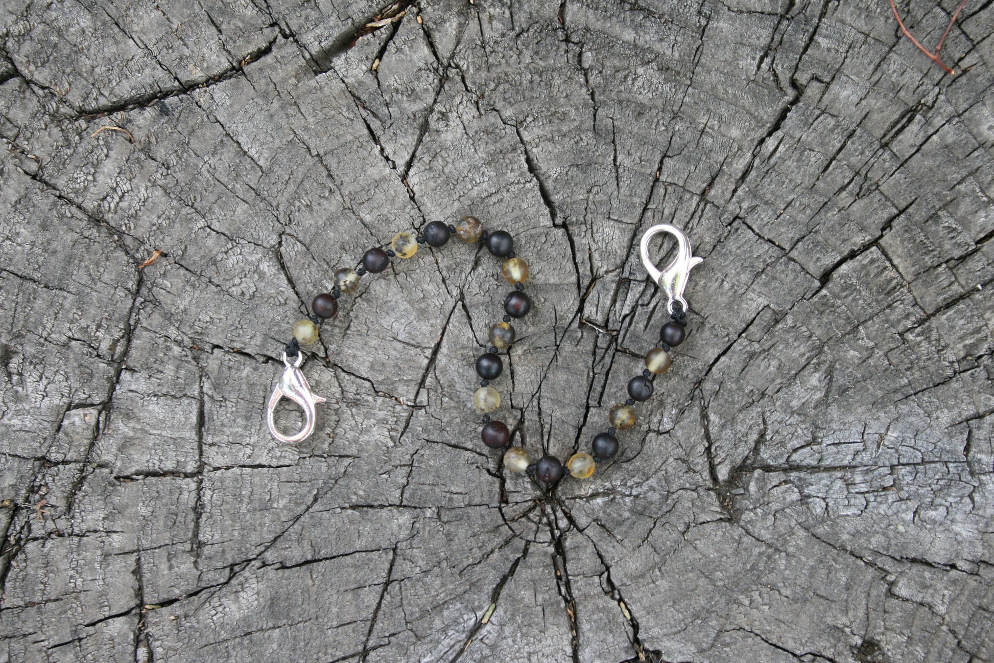 Picture is with green colored ambers(#13) - Baltic Amber Trach Chain, Healing Jewelry, Unpolished & Raw, Trach Strap, Trach Holder Media (baltic amber variation bracelet / necklace on wooden background)