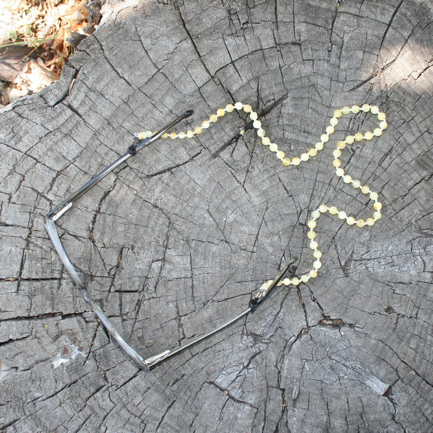 Glasses pictured with Baltic Amber chain holder (pictured on wooden background)