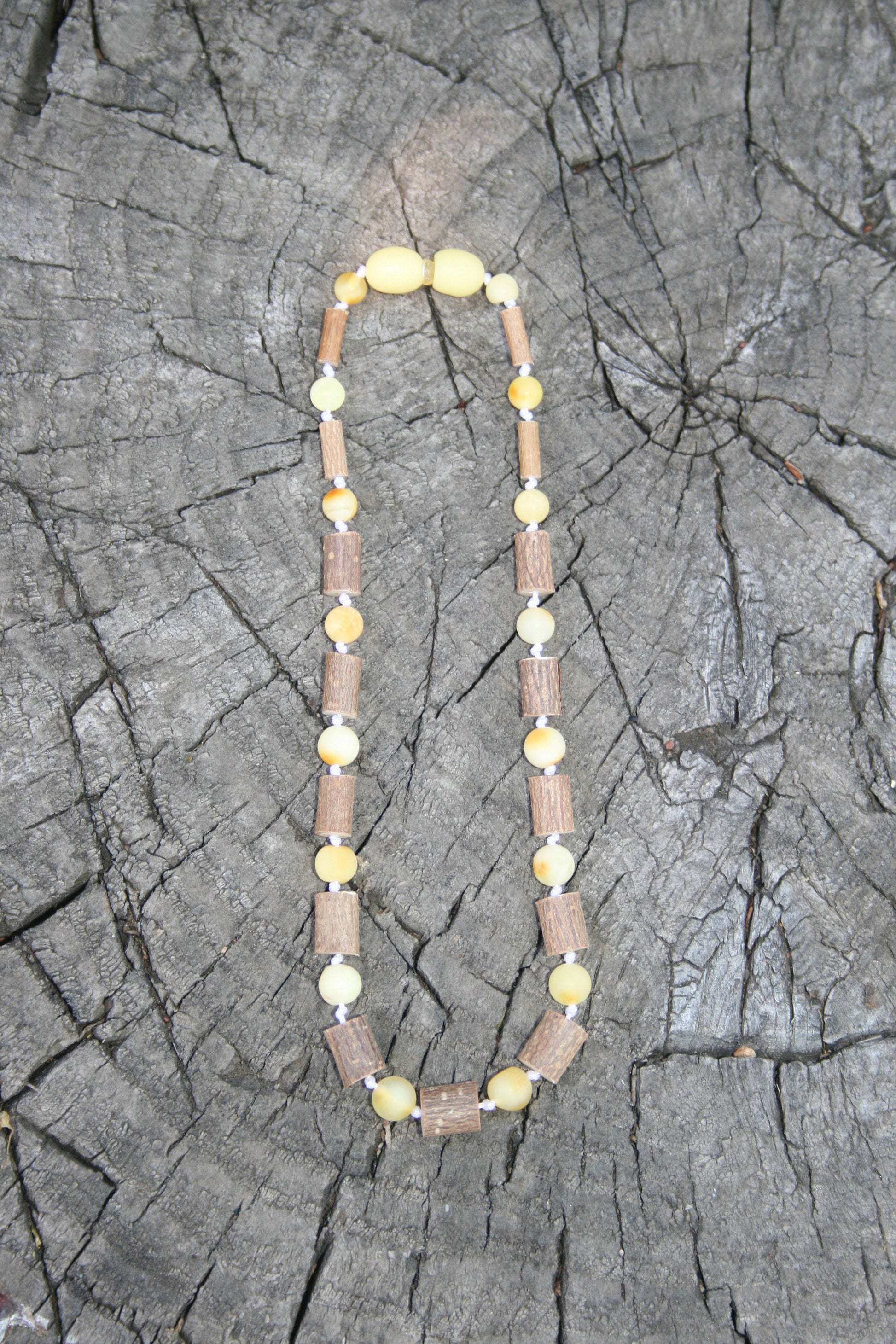 Picture  is of hazelwood and milky colored amber. (Jewelry on wooden background)