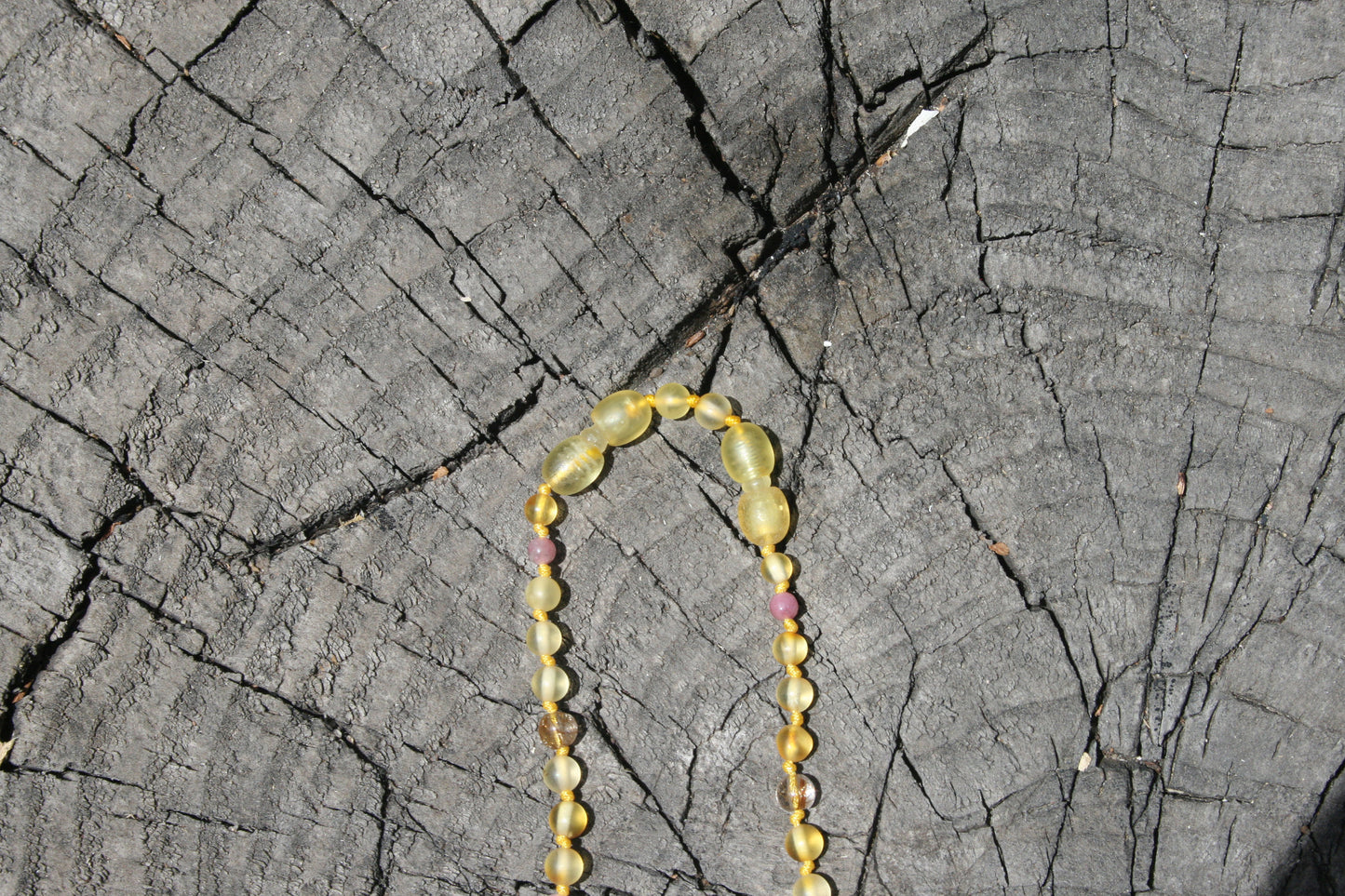 Picture 6 is a lemon extender in use. (jewelry on wooden background)