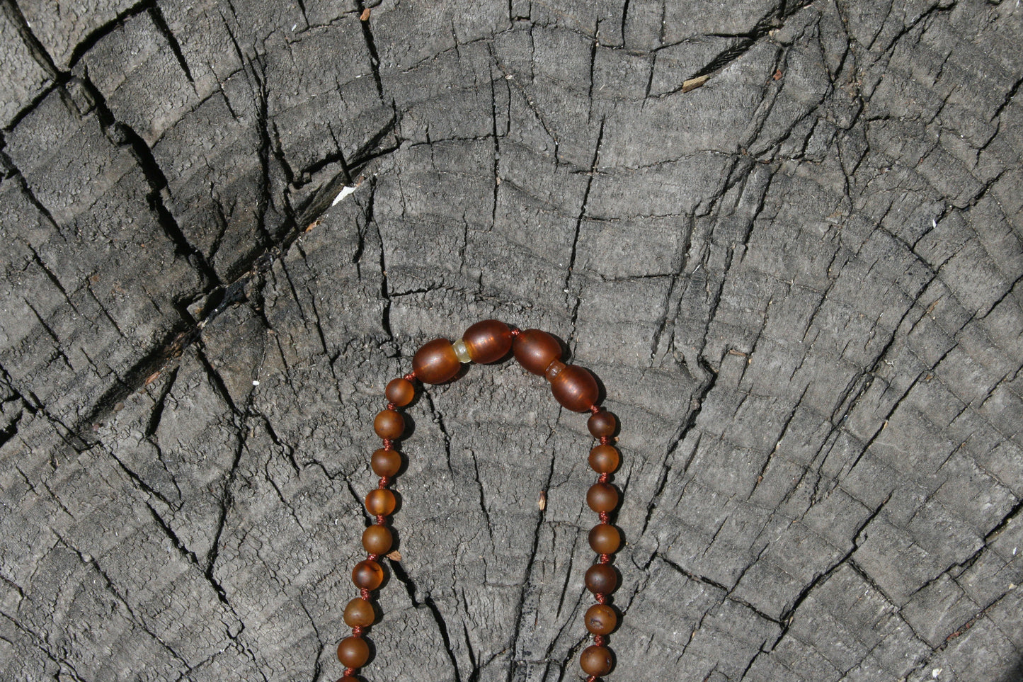 Picture 7 is a cognac extender in use. (Jewelry on a wooden background)