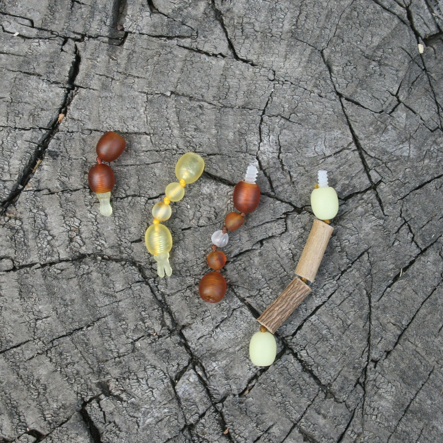 This gives you the option to turn your safety clasp item into a screw clasp item or vice versa (I recommend gluing the safety clasps), but these add 1.5" the item because these 2 clasps together total 1.5". (picture 8) (pictured jewelry on a wooden background)